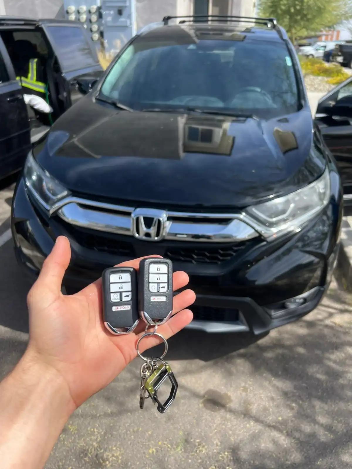 Mobile locksmith creating a replacement car key with Locksmith Services in Tempe for a modern vehicle