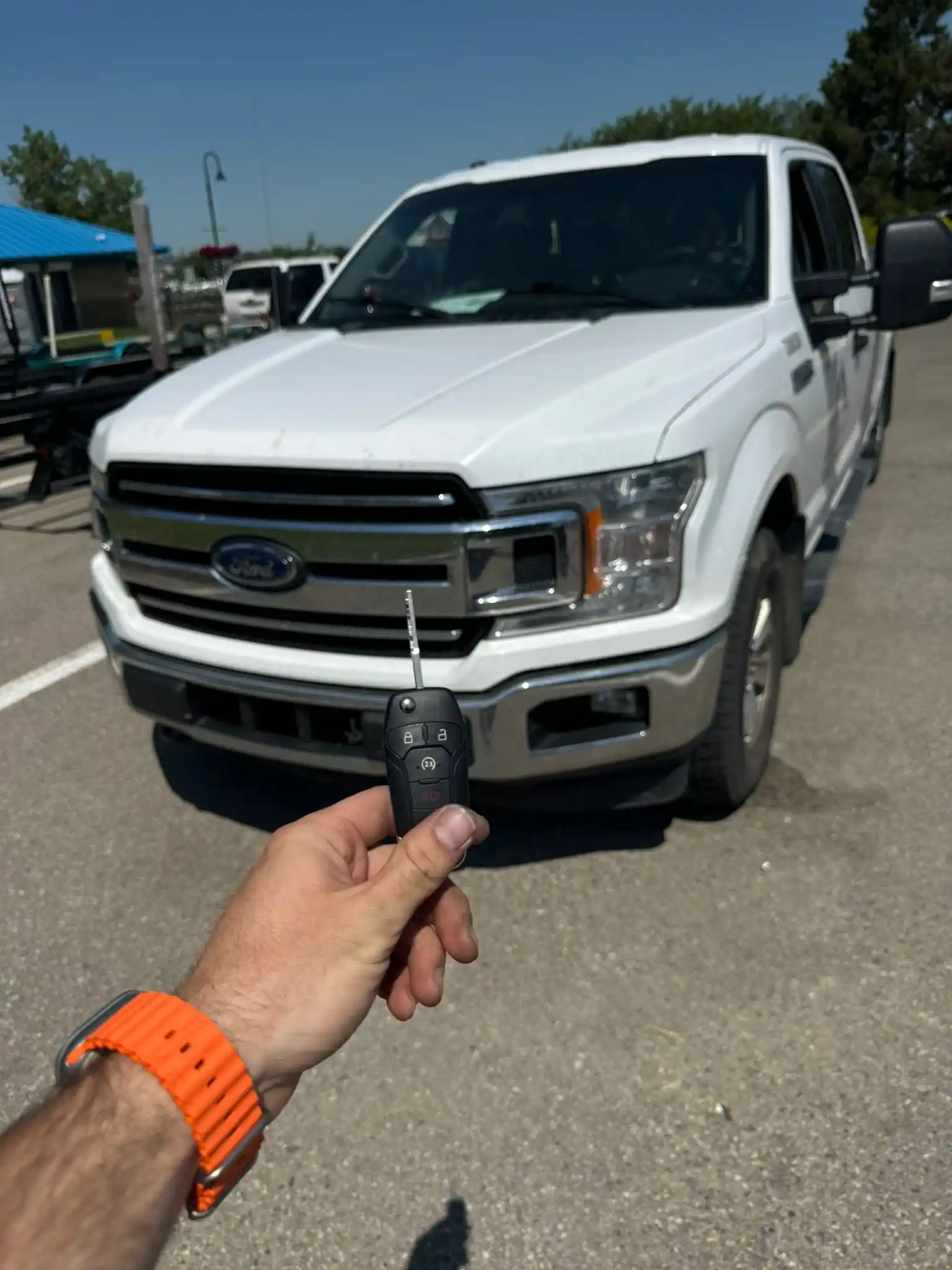 Locksmith Services in Gilbert helping a driver regain access to a locked car using professional tools