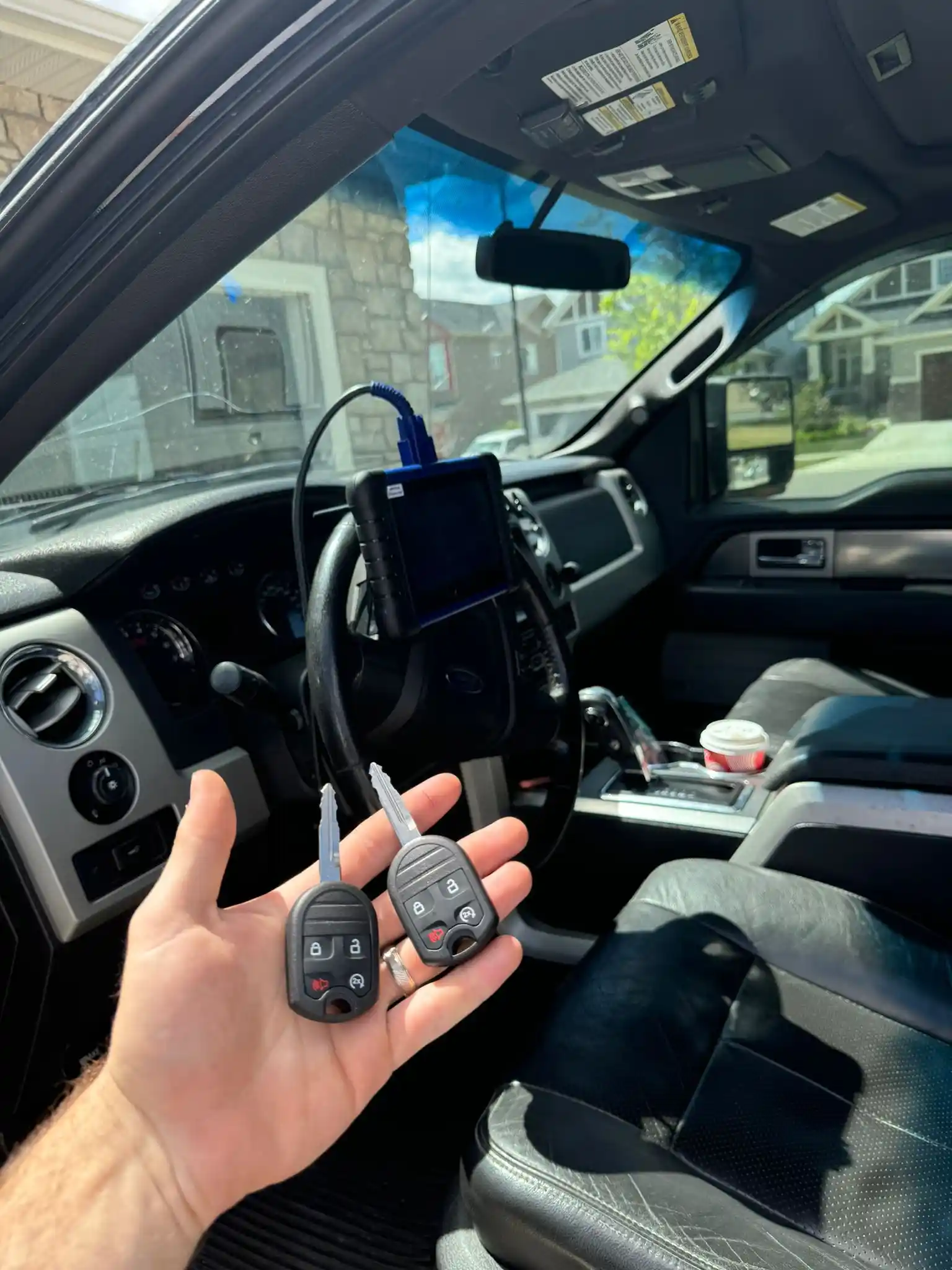Professional Auto locksmith unlocking a vehicle safely without causing damage