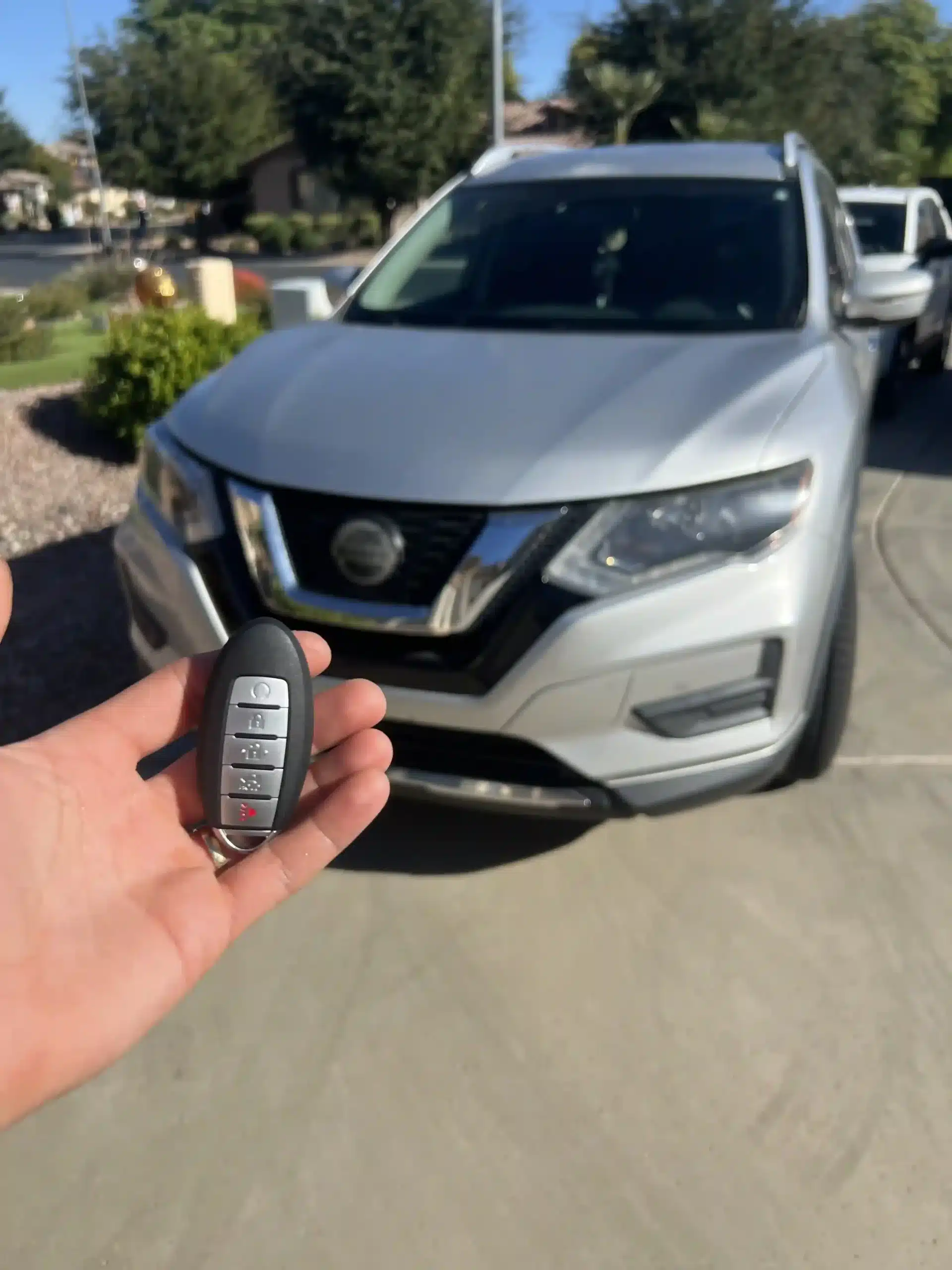 Technician providing Locksmith Services in Phoenix to unlock a locked car door safely